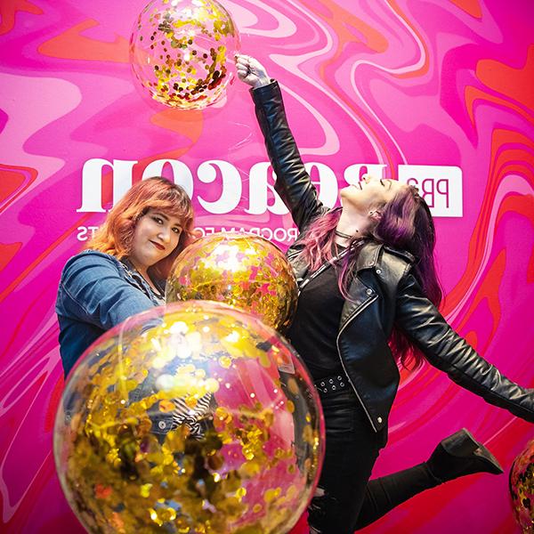 http://658.eventoshappyever.com/wp-content/uploads/2023/06/two-women-holding-balloons-in-front-of-a-pink-pba-beacon-wall.jpg